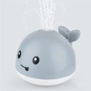 Beleuchtetes Wal-Wassersprinkler-Poolspielzeug für Babys